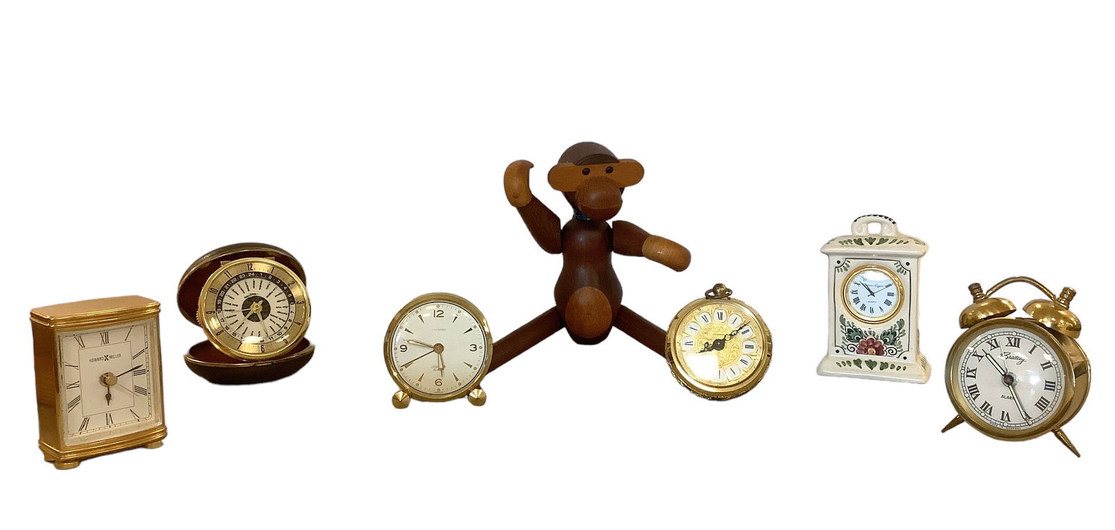 Kay Bojensen Monkey Figurine and Assortment of Vintage Alarm Clocks: Mid-century Teak Monkey Sculpture by Kay Bojesen Danish monkey, 10” tall. (2) rectangular clocks, (4) round clocks, heights range from 3”-4”. Not tested.
