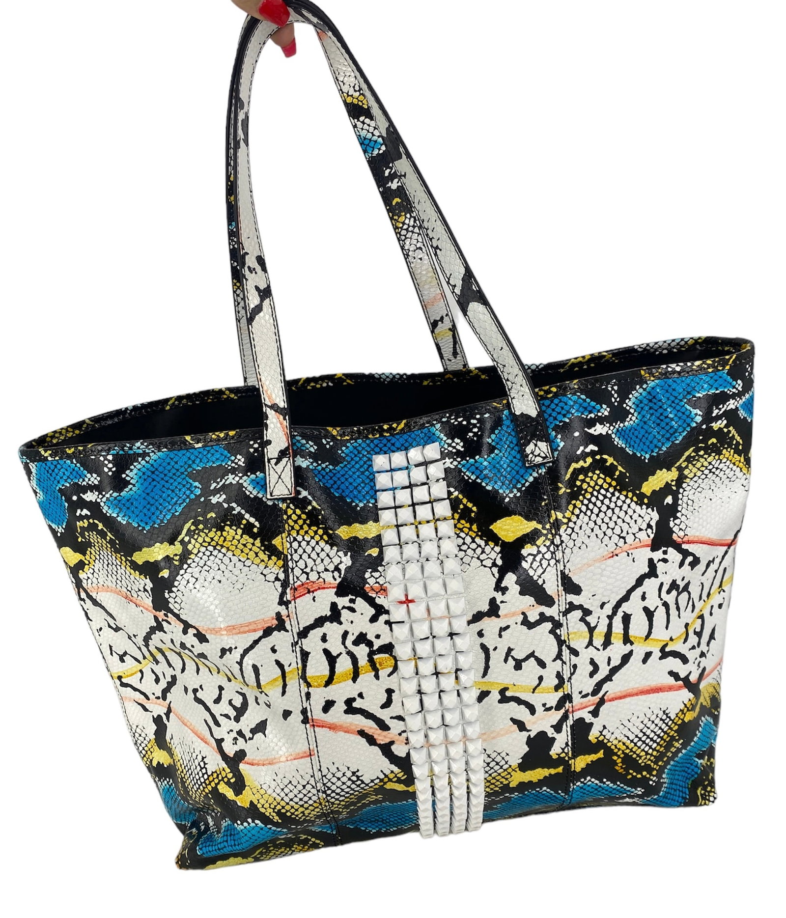 L.A.M.B. Printed Leather Tote: L.A.M.B. Printed Leather Tote Measuring approx. (20" x 5.25" x 13") with a vibrant printed design featuring an embossed snakeskin texture, white studs accent the front of the bag, matching pouch inclu
