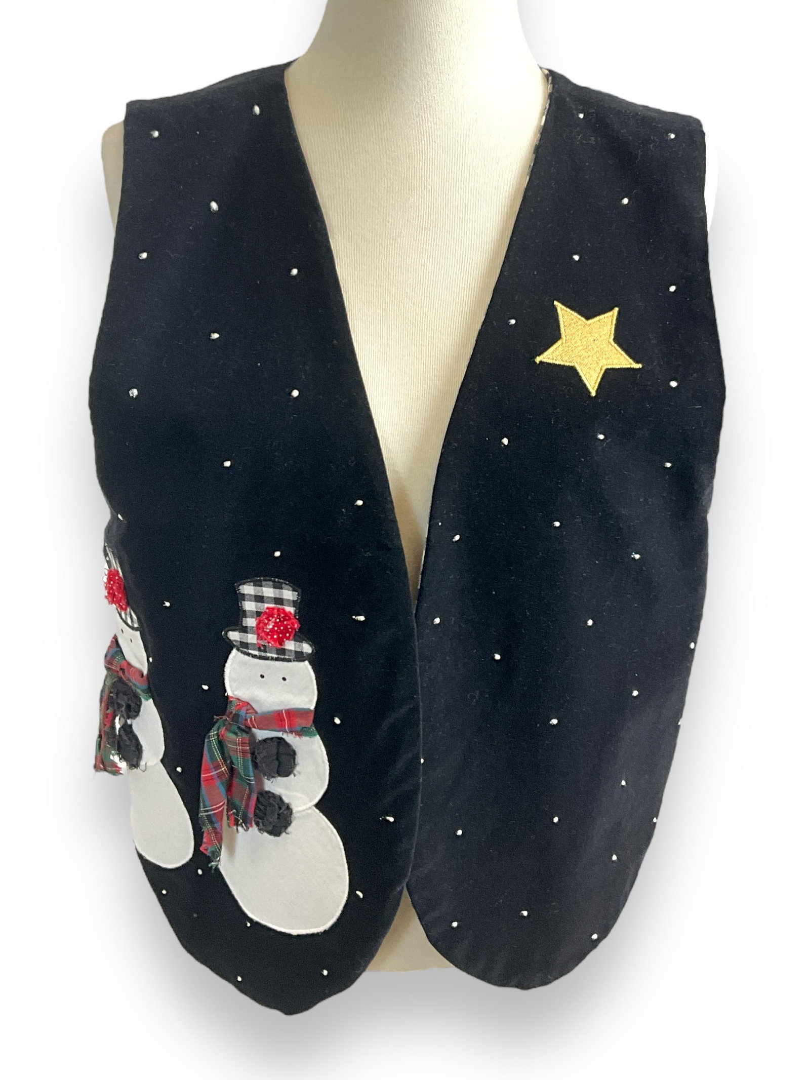 Snowy Snowman Vest: Snowy Snowman Vest Velvet like vest with a a pair of snowmen in the snow. Checkered black and white lining, and cinched back. Great for a winter day layered over a white shirt.