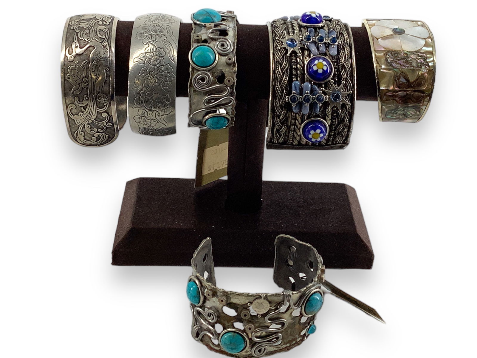Lot Of Six Cuff Bracelets: Lot Of Six Cuff BraceletsIncludes styles from Treska (modern designs), base metal composition(s), includes floral-adorned and Southwestern styles. Mixed conditions.