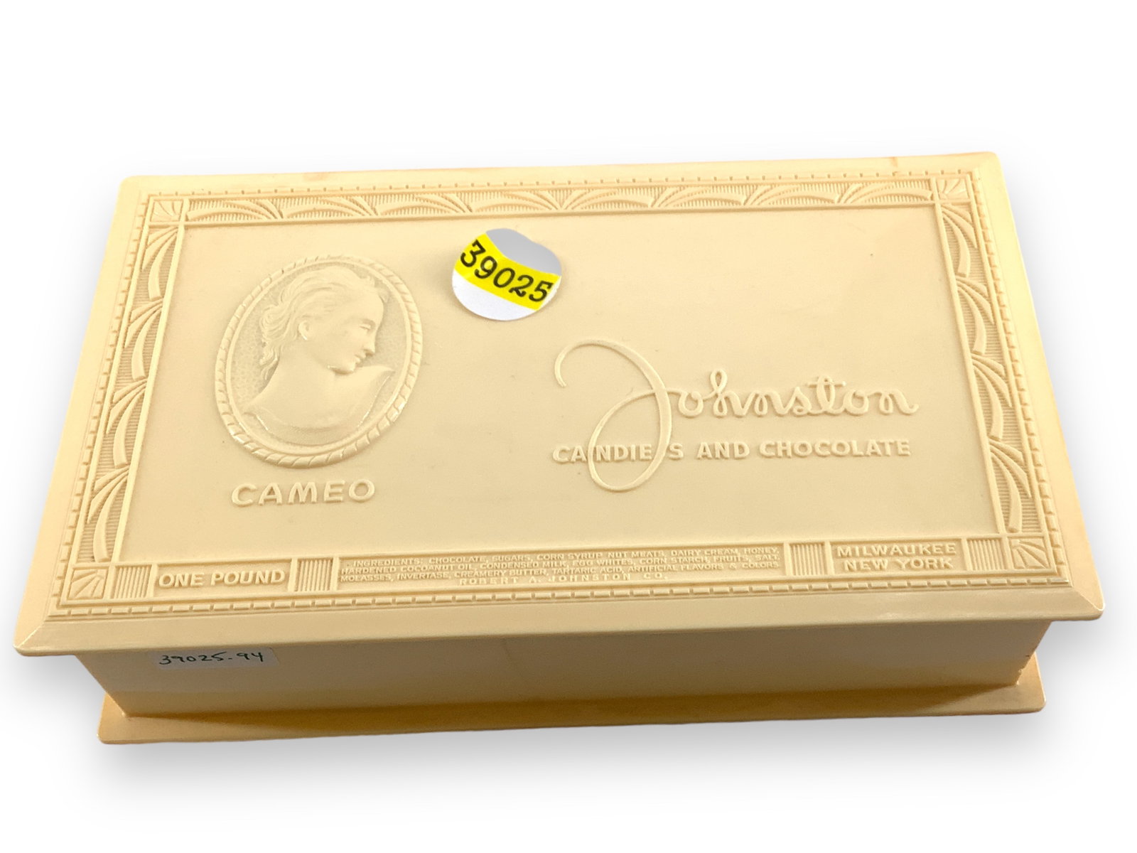 Vintage Celluloid Boxes with Contents: Vintage Celluloid Boxes with Contents Vintage cream color celluloid boxes, one states "Cameo, Johnston Candies and Chocolate," is 8 1/2" wide, 2" tall and 5" deep and contains a leather braided neckla
