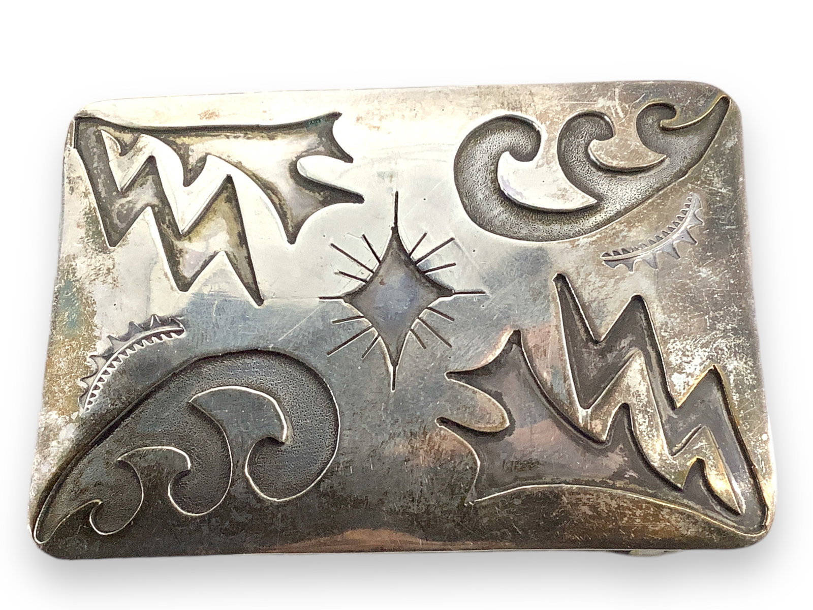 Southwestern Sterling Silver Belt Buckle: Southwestern Sterling Silver Belt Buckle Tested sterling silver/925, signed "J. Toadlena", circa 1977, 75.0mm x 53.5mm in size, 1.42 troy ounces total weight, features traditional Southweste