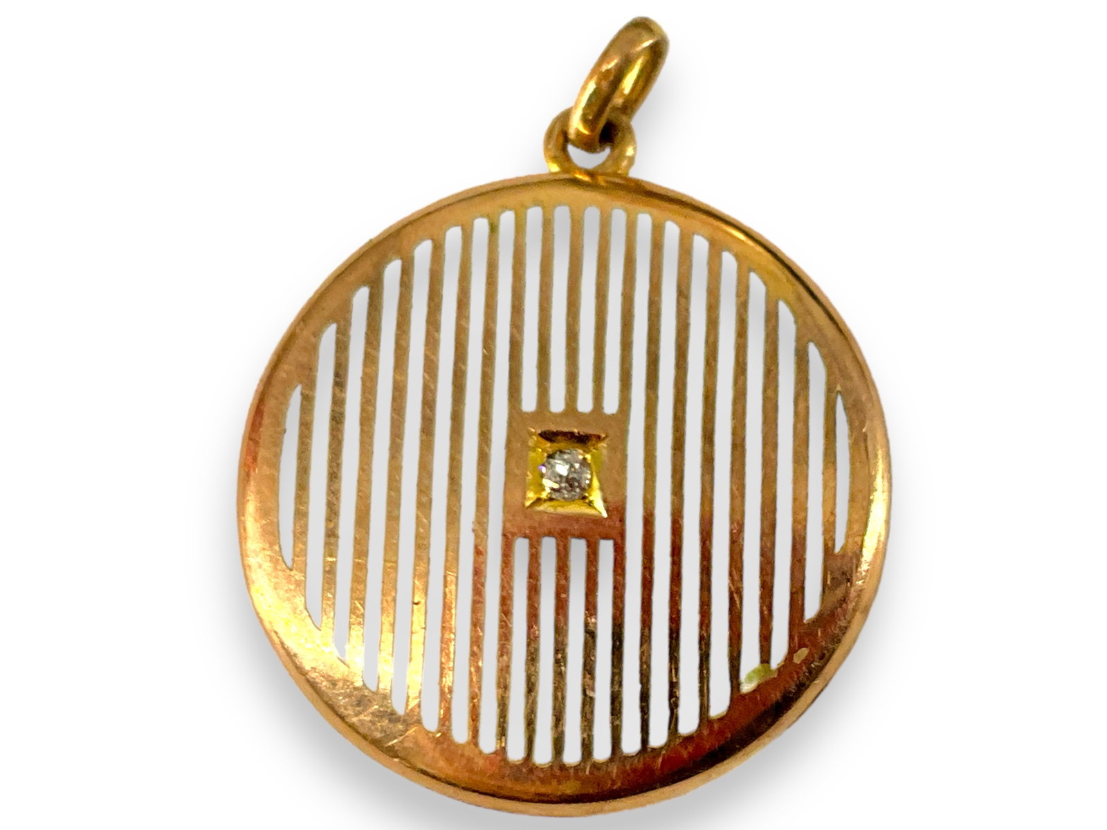 Antique 10kt Yellow Gold Locket with Diamond & Enameling: Not stamped, electronically tests as 10kt, bid with discretion, measuring approx. (1.28’) in length including the jump ring, featuring white enameling on one side in a striped pattern accented with 