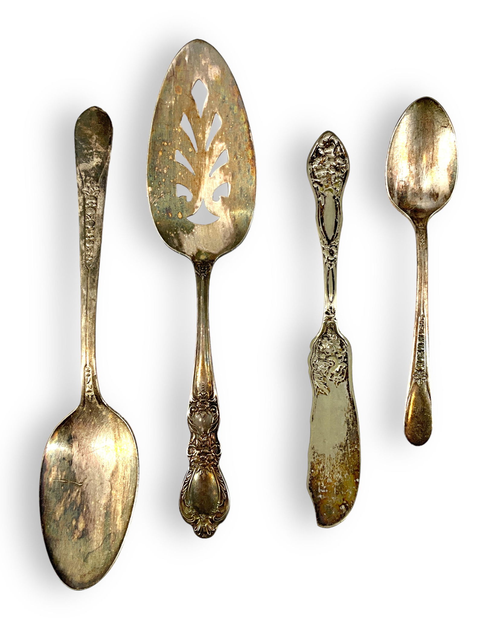 Silver Plated Serveware: Silver Plated ServewareOne serving spoon, one cake sever one tablespoon, one butter knife.
