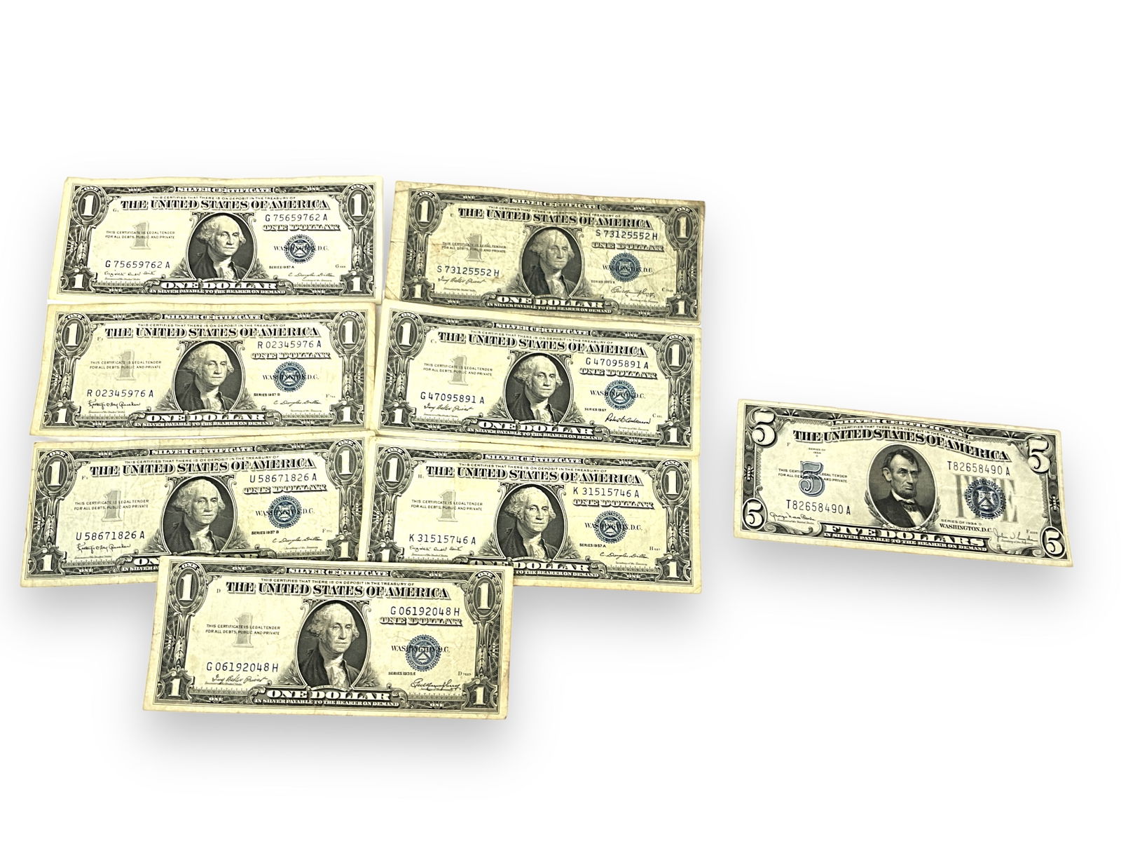 Seven U.S. $1.00 Silver Certificates and One $5.00 U.S. Silver Certificate (1 of 3)