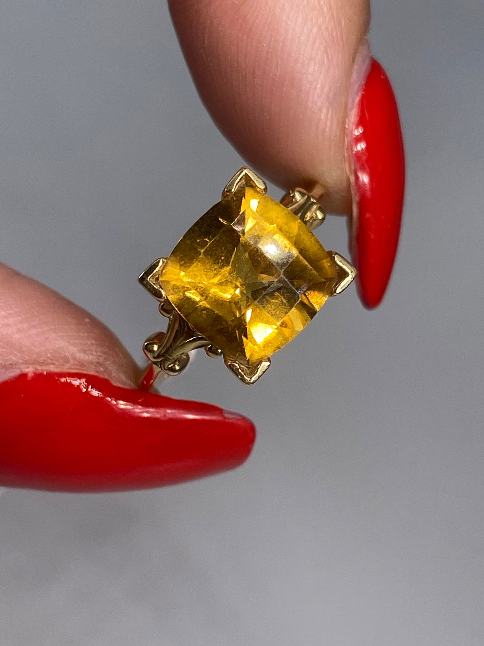 14kt Gold and Citrine Stone Solitaire Ring: 14kt Gold and Citrine Stone Solitaire RingCheckerboard cut 10.0mm citrine stone at center, stamped and tested 14kt yellow gold, size 7 reverse tapered shank ring with semi-polished metal finish, 4.3 g