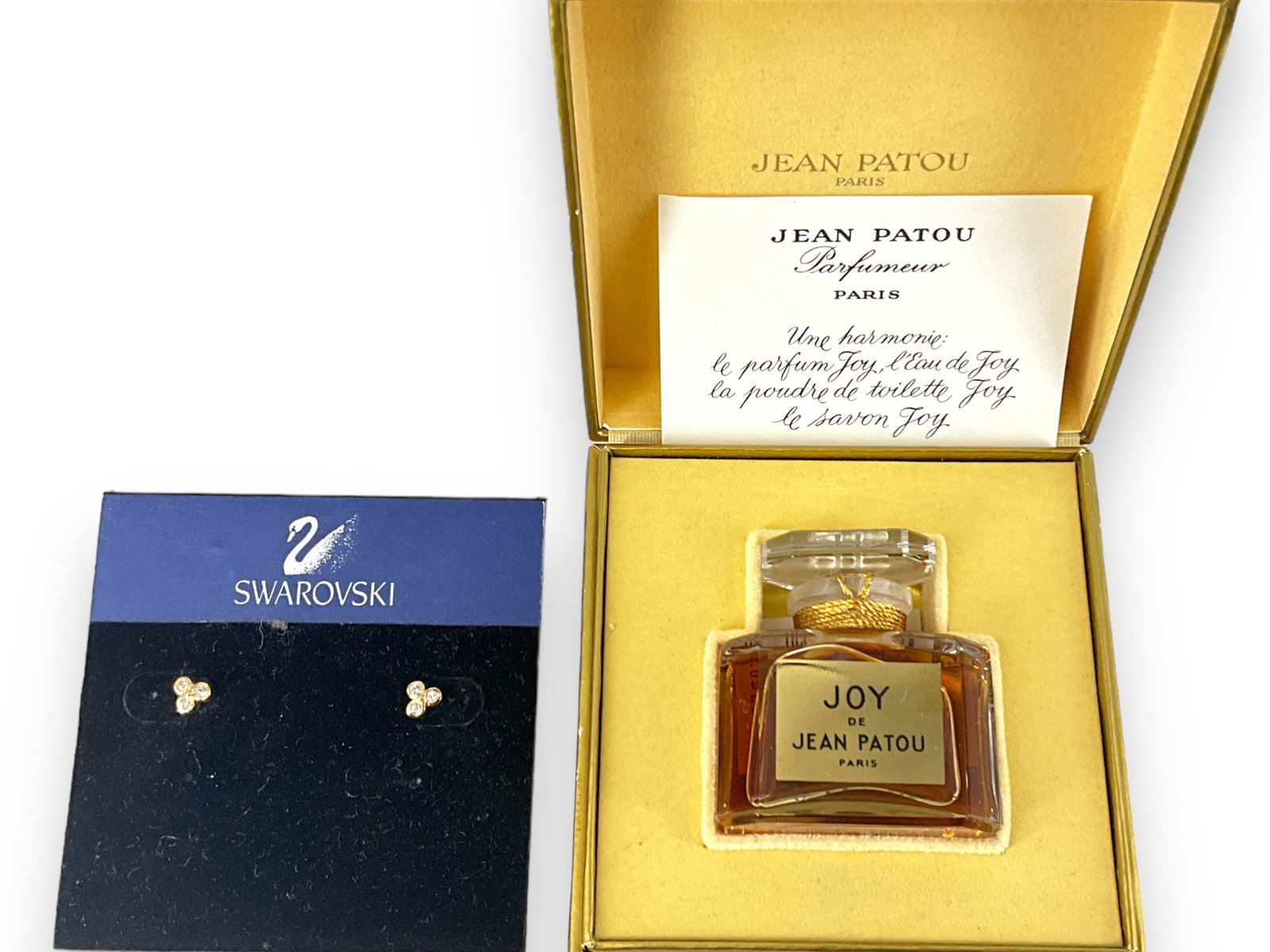 Unopened Bottle of Joy Perfume and Tiny Swarovski Earrings: Unopened Bottle of Joy Perfume and Tiny Swarovski Earrings Unopened bottle has the original box stating, "Parfum Joy Jean Patou Made in France 1/2 fl. Ounce." Original paperwork is included and there 