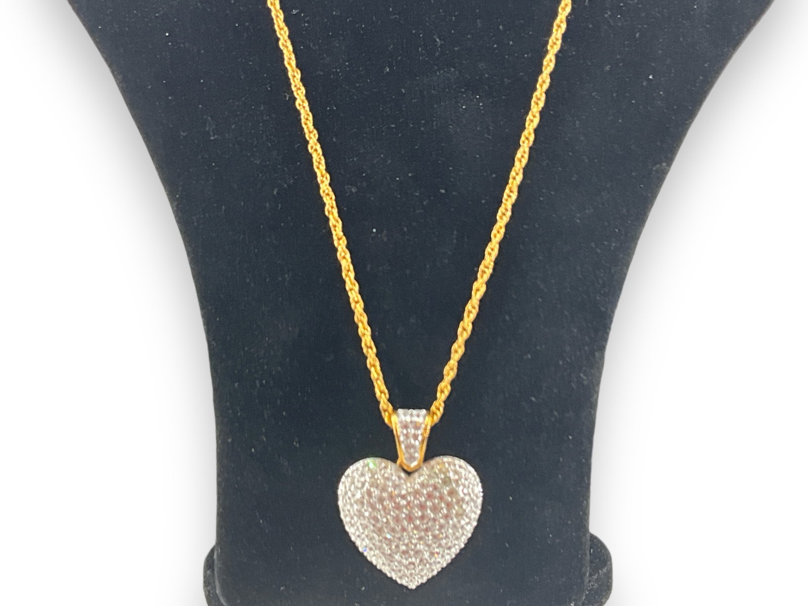 Swarovski Crystal Necklace: Swarovski Crystal Necklace Spiral chain measuring (33") in length with a (1.72") heart shaped slide pendant with clear Swarovski crystal adornments, fold over clasp closure.