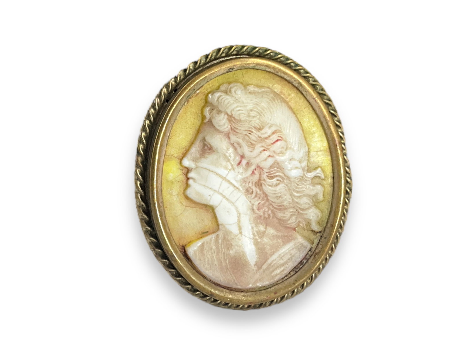 Antique Cameo Style Pendant: Antique Cameo Style PendantMeasuring approx. (1.6" x 1.3") gold tone bezel setting, unknown campe medium possibly pressed plastic, leftward facing portrait.