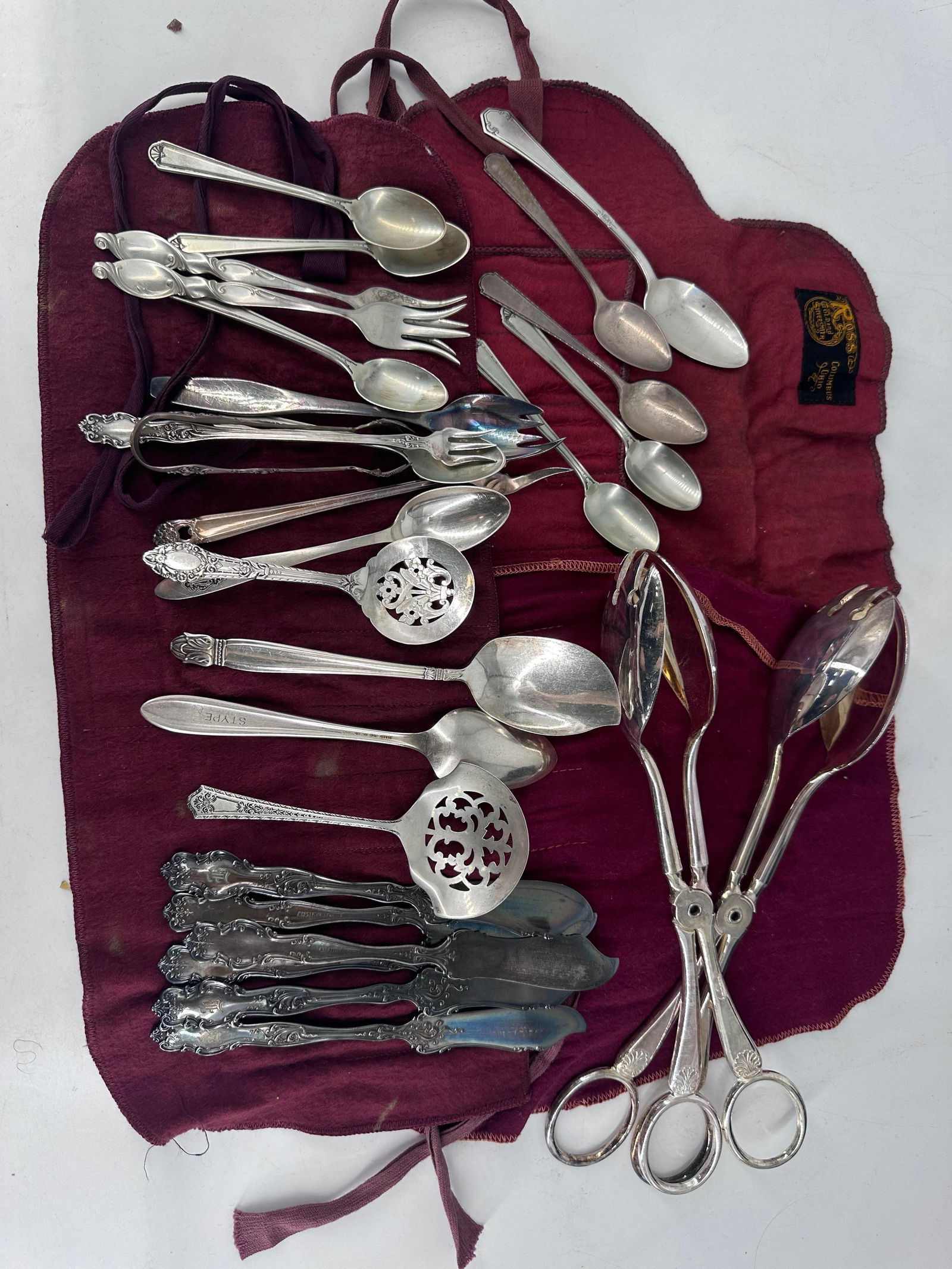 Silver Plate and Sterling Silver Flatware and Serveware: Silver Plate and Sterling Silver Flatware and ServewareItalian made tongs, silver-plated spreaders from Rogers, six matched sterling silver demitasse spoons, additional silver plated items from Holmes