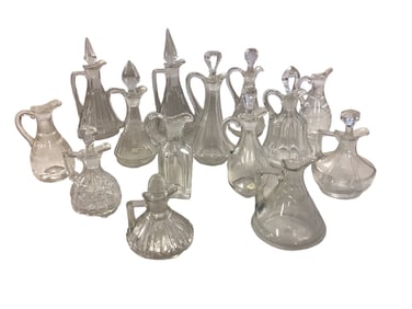 Lot of (14) Heisey Cruets some marked H and some with starburst .