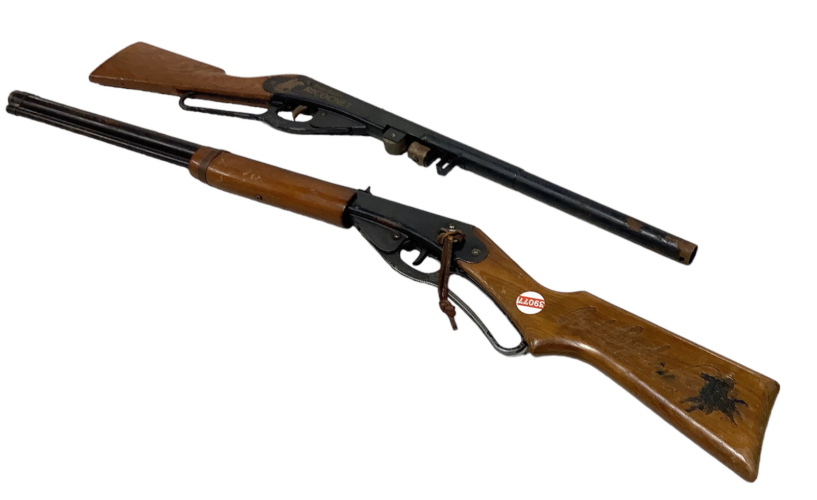 Two Daisy Vintage B-B Guns: Two Daisy Vintage B-B Guns A Daisy Red Ryder No. 1938 wooden stock Carbine B-B gun measuring 36" long. A Daisy Trail Rider Ricochet Model 660 ToyGun, measuring 30.5" and missing the forearm grip as sh