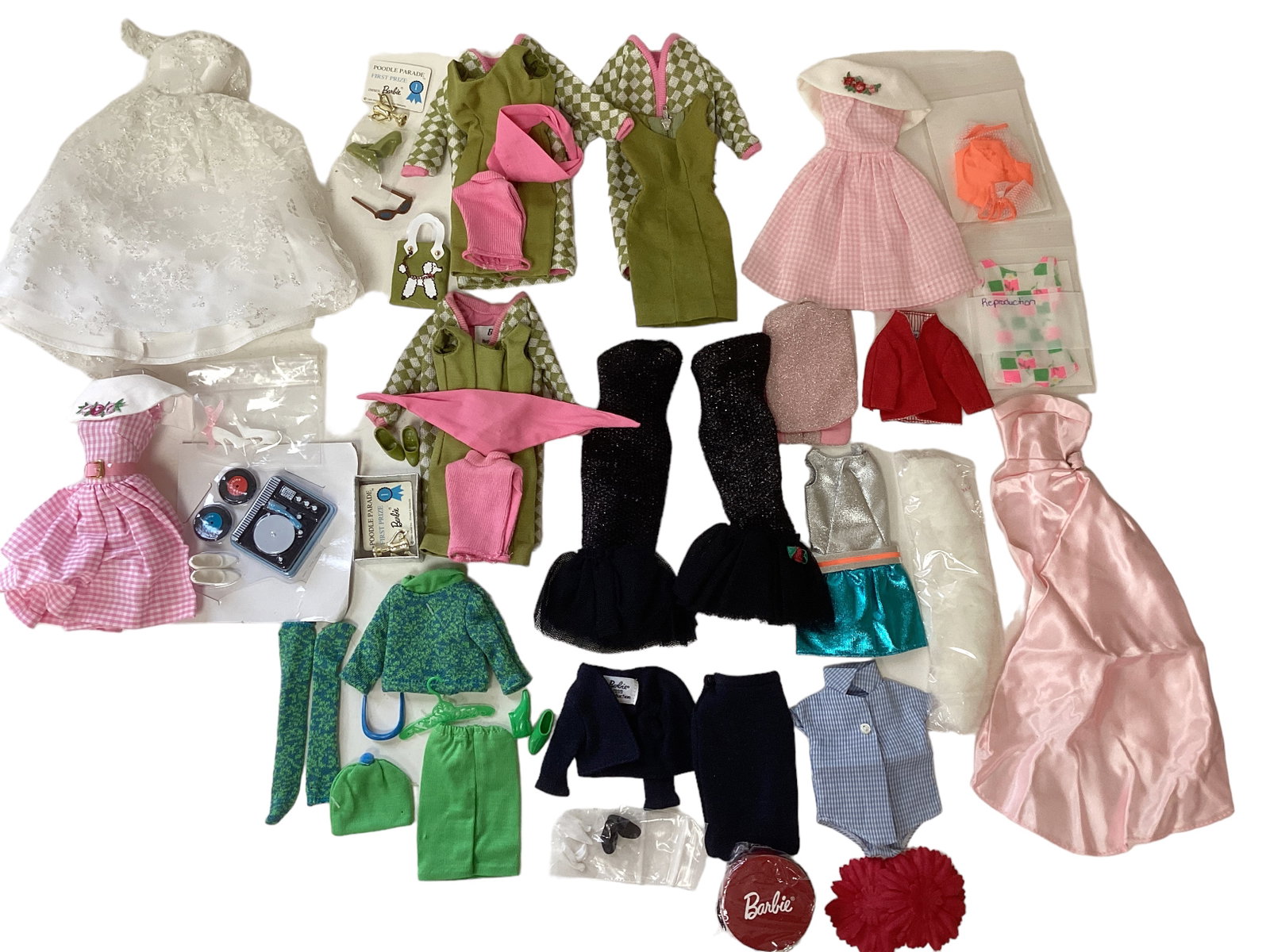Lots of Barbie Reproduction Clothes: Lots of Barbie Reproduction Clothes Some repeat, some are outfits. Most in great condition, one spotlight dress has rip/ tear at bodice top & is missing flower.