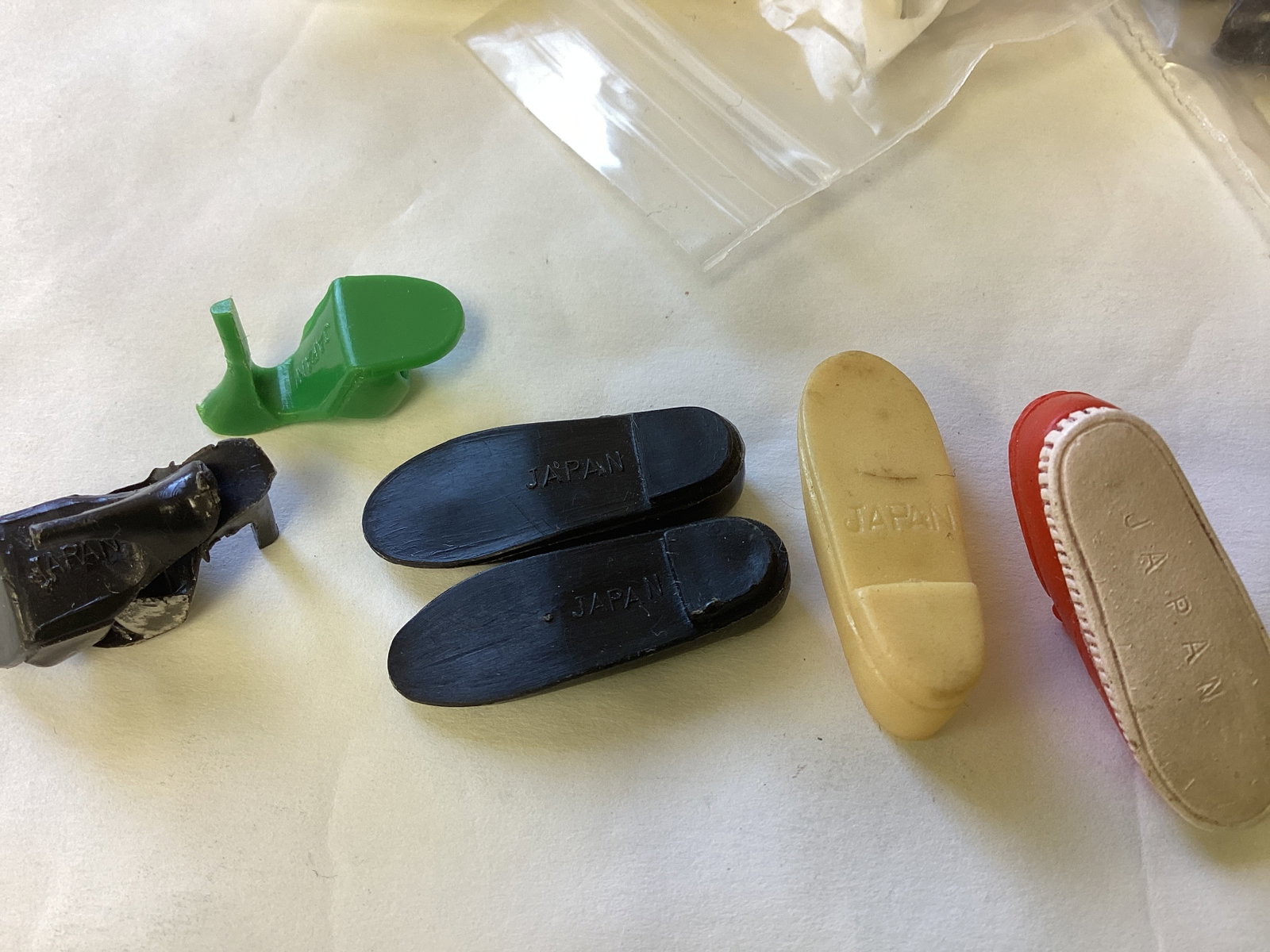 "Mixed Shoes, Many Colors & Types from all Over.: "Mixed Shoes, Many Colors & Types from all Over. Japan, Philippines, Taiwan, unmarked, Korea, Hong Kong. Not every shoe has a mate, there are at least 50 pairs.