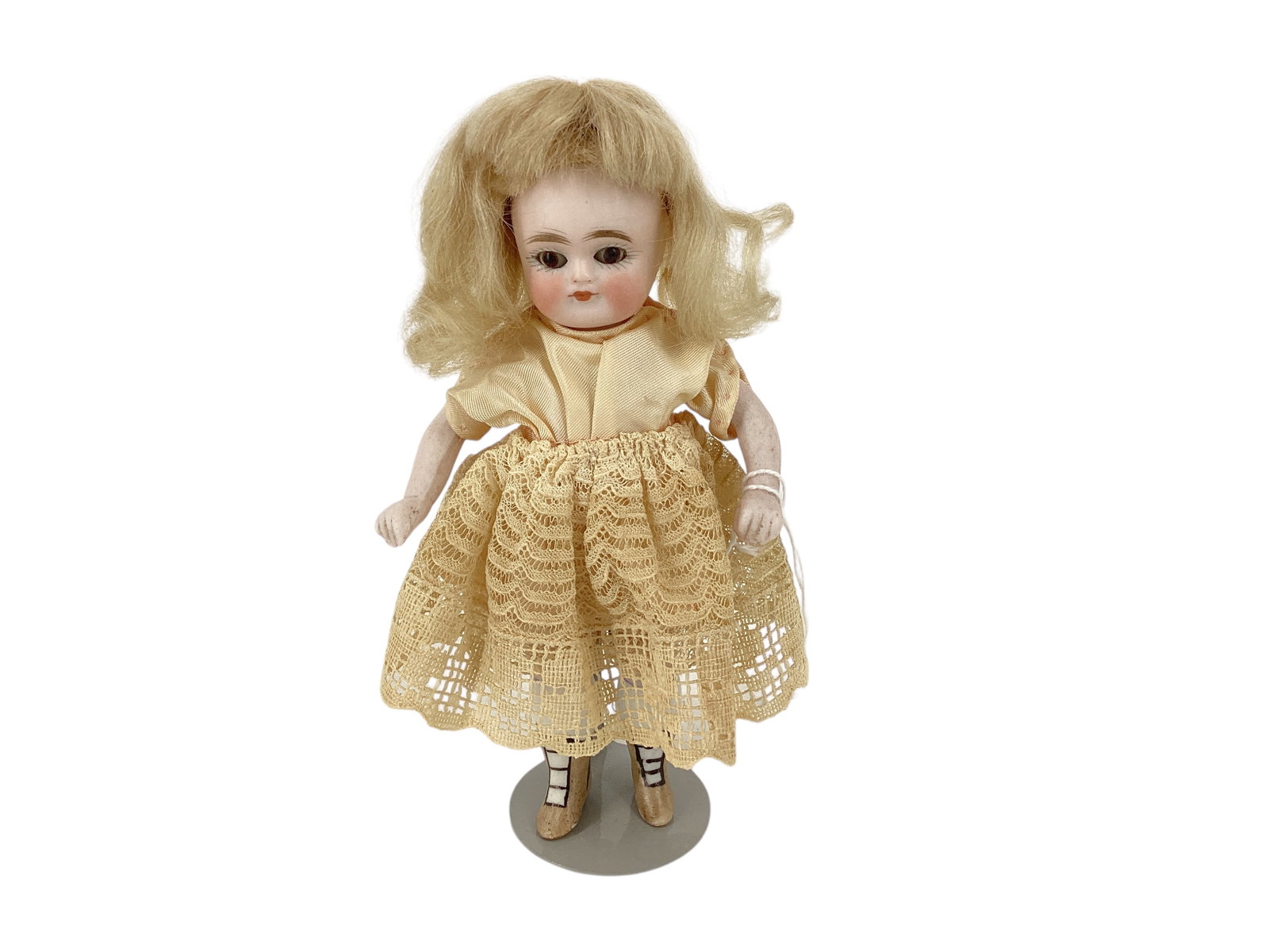 Petite All-Bisque Girl with Yellow Boots: Petite All-Bisque Girl with Yellow Boots 5 1/2" doll with one-piece head/torso, string jointed arms and legs, mohair wig, glass sleep eyes, closed mouth, molded and painted yellow boots and white