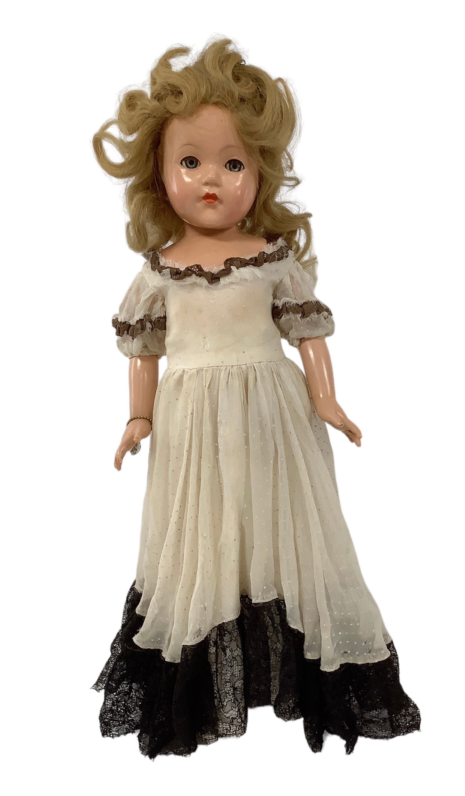 Effanbee "Anne Shirley": Effanbee "Anne Shirley"20" composition doll with human hair wig, sleep eyes with eyelashes, closed mouth, five-piece body. Clothing appears to be original. Wig is mussed, crack from for