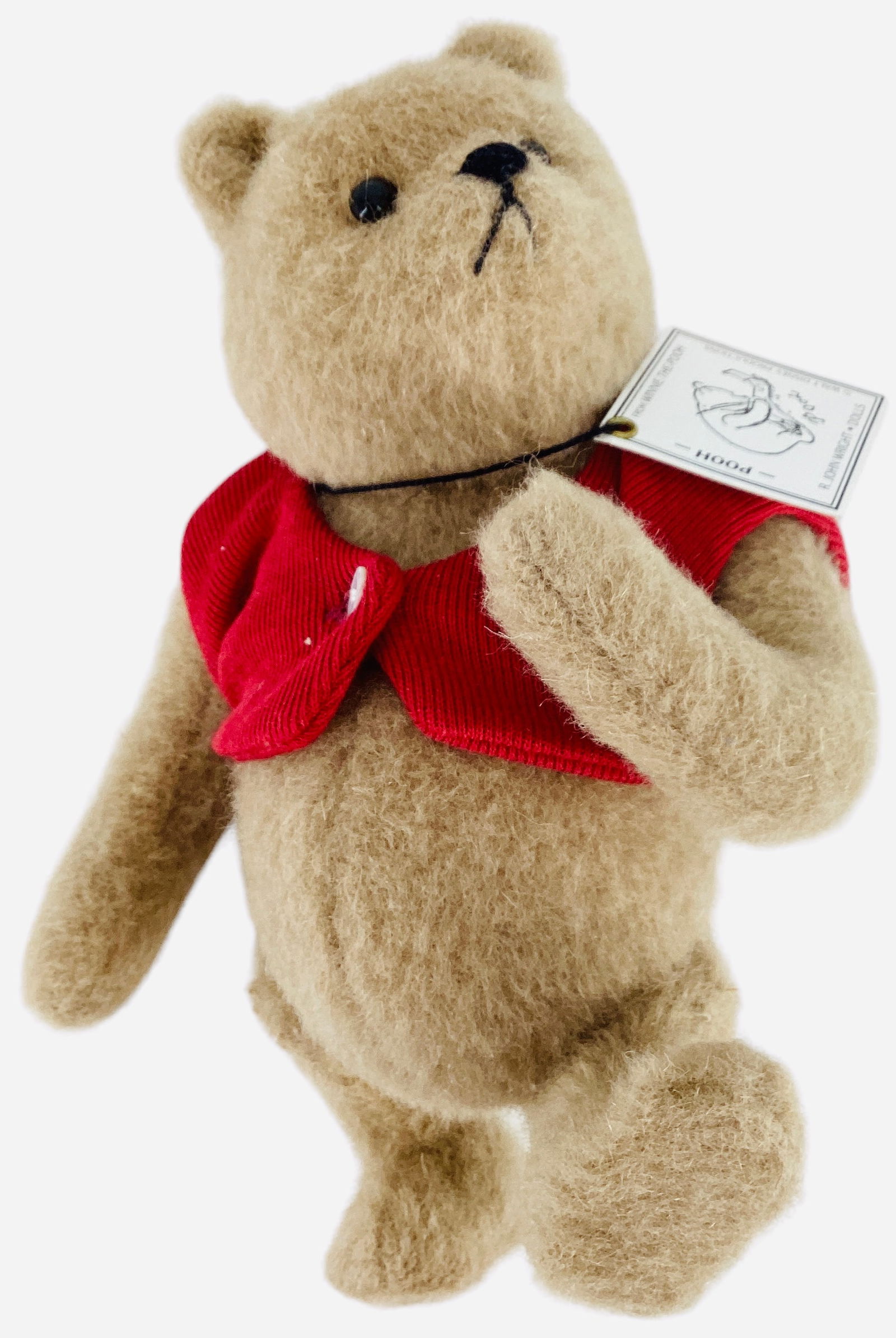R. John Wright "Winnie-the-Pooh": R. John Wright "Winnie-the-Pooh"8" mohair plush bear jointed at the neck, shoulders and hips, applied ears, glass bead eyes, stitched nose. Limited Edition No. 1694/2500, comes in origi