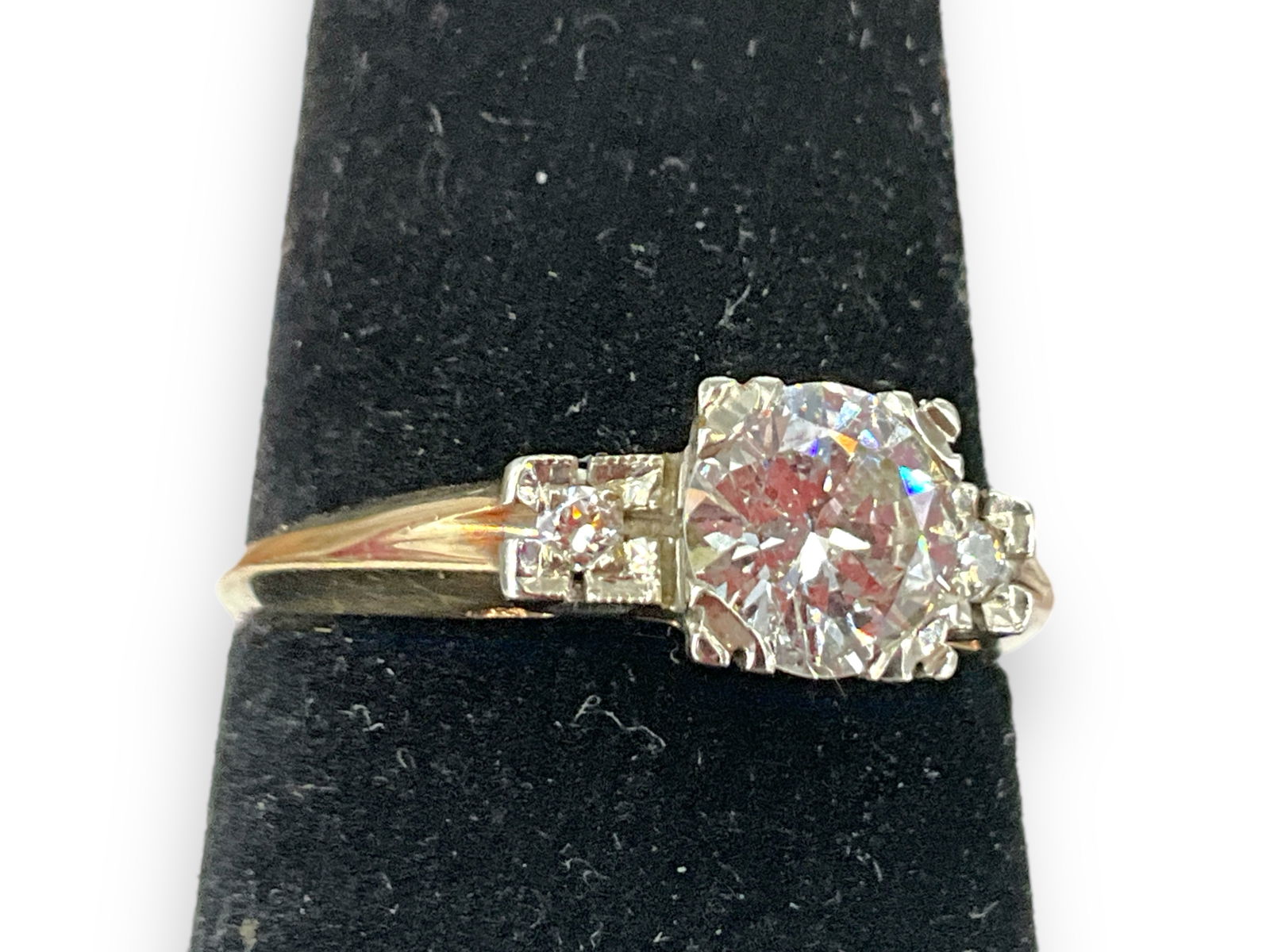 Vintage 14kt Yellow Gold Diamond Engagement Ring: Vintage 14kt Yellow Gold Diamond Engagement RingSize (7), with a yellow gold shank and white gold head with a (6mm) round brilliant diamond center stone (SI) accented with a (1.4mm) diamond on each si