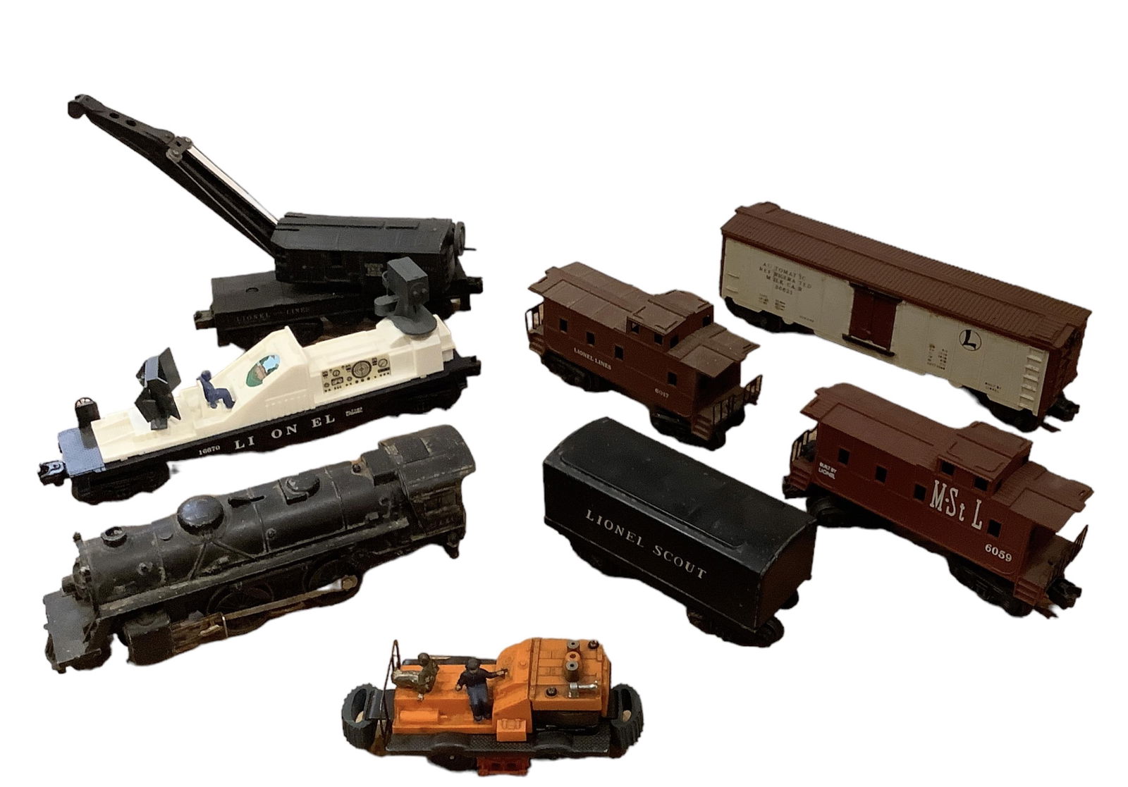 Lionel Postwar and Modern Era Freight Cars Lot of (8): Lionel Postwar and Modern Era Freight Cars Lot of (8)(1) #6110 2-4-2 engine, (1) Scout tender (1) #3662 automatic milk car (1) #50 gang car (1) #6017 caboose (1) #6059 St, L caboose(1) #16670 TV car (