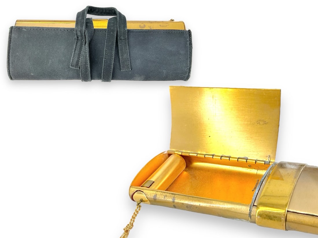 Vintage Compact: Vintage Compact Perfect for your next night out or vintage collection, oval cylindrical design gold tone with center slide that opens to revel two compartments including one side with mirror and powde