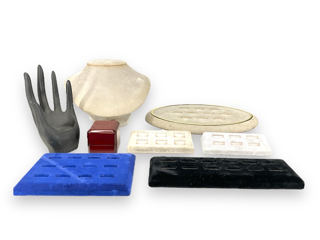 Jewelry Store Displays: Jewelry Store DisplaysOne oval shaped ring display, on necklace display, several small ring holders, one wooden jewelry box and one hand with palm.