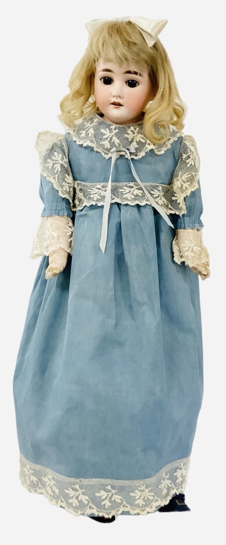 Cuno & Otto Dressel bisque shoulder head girl.: Cuno & Otto Dressel bisque shoulder head girl.24" doll with original mohair wig, glass sleep eyes, open mouth with teeth, crude cloth body with composition lower arms. Bisque is good with no dama