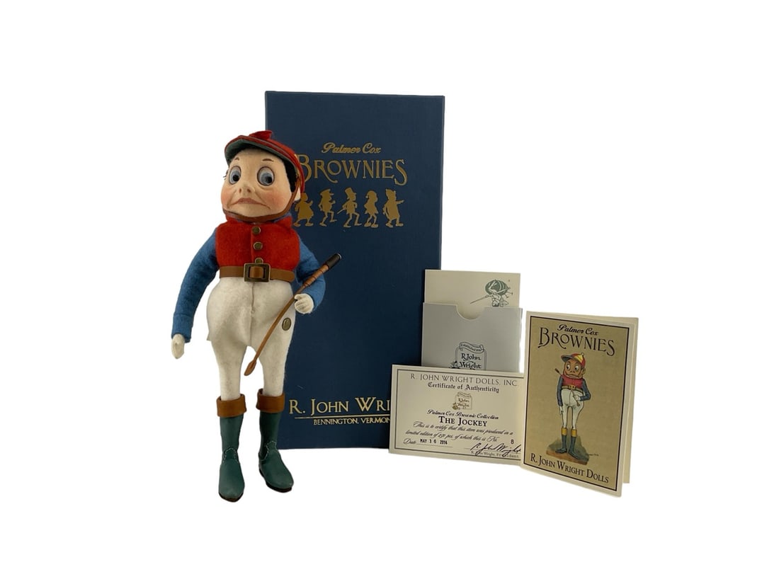 Palmer Cox Brownie Collection "The Jockey" #8/250 by R. John Wright.: Palmer Cox Brownie Collection "The Jockey" #8/250 by R. John Wright.The Jockey is 8.5" tall. His uniform, cap, shirt and jodhpurs are made of all-wool. With leather boots and riding crop. Dated May 16