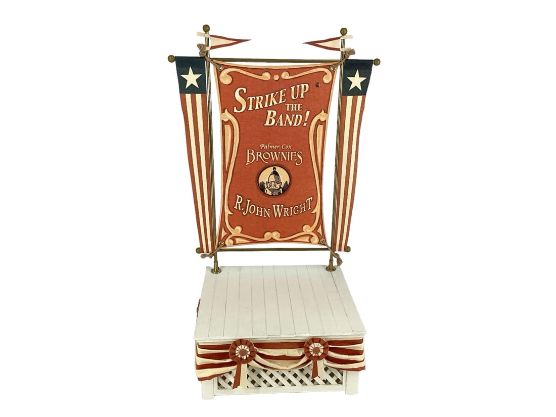 Palmer Cox Collection "Strike Up The Band!" Artist Proof #2/5 by R John Wright Overall 21.5"t, Stand: Palmer Cox Collection "Strike Up The Band!" Artist Proof #2/5 by R John WrightWood and metal bandstand with printed felt banners and bunting. Date of Release: 2007 Limited Edition: 50. Part of the Pal