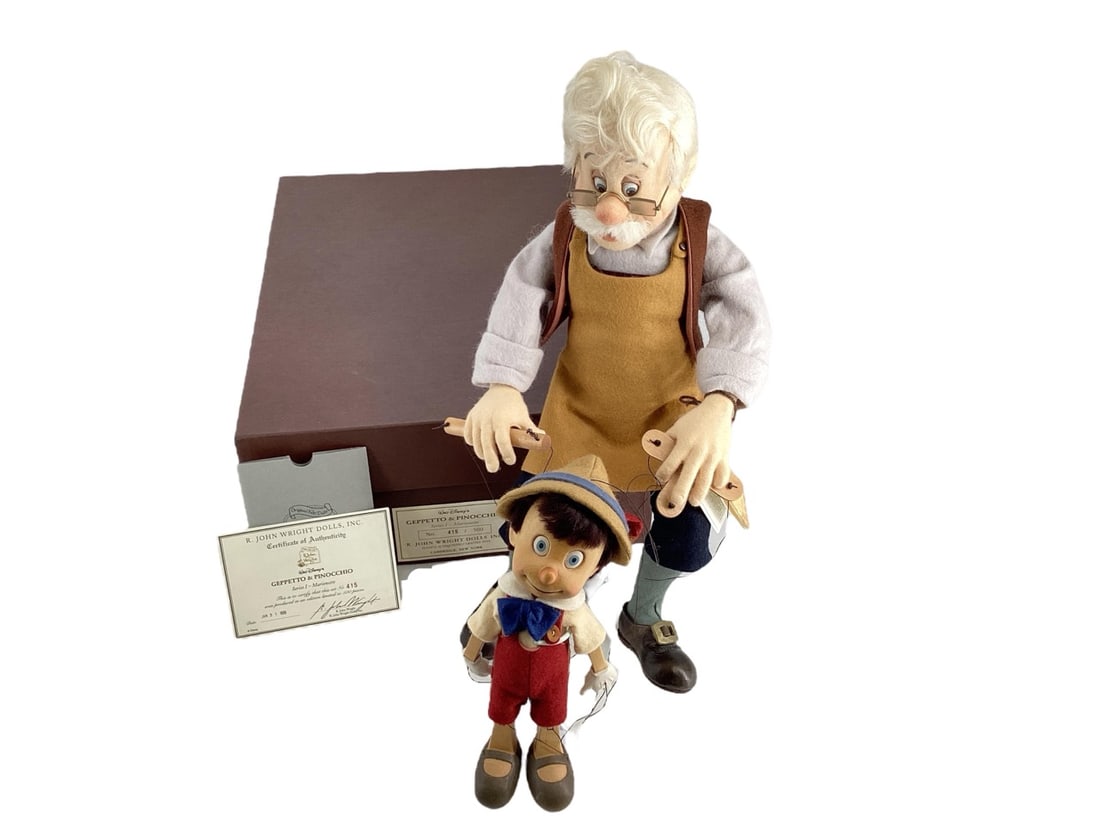 R. John Wright Certified Walt Disney's "Gepptto & Pinocchio" #415/500.: R. John Wright Certified Walt Disney's "Gepptto & Pinocchio" #415/500.Series I - Marionette dated Jan 31, 1995. Fully Jointed 18" and 9" molded felt and hand carved Alpine maple.Edition Note