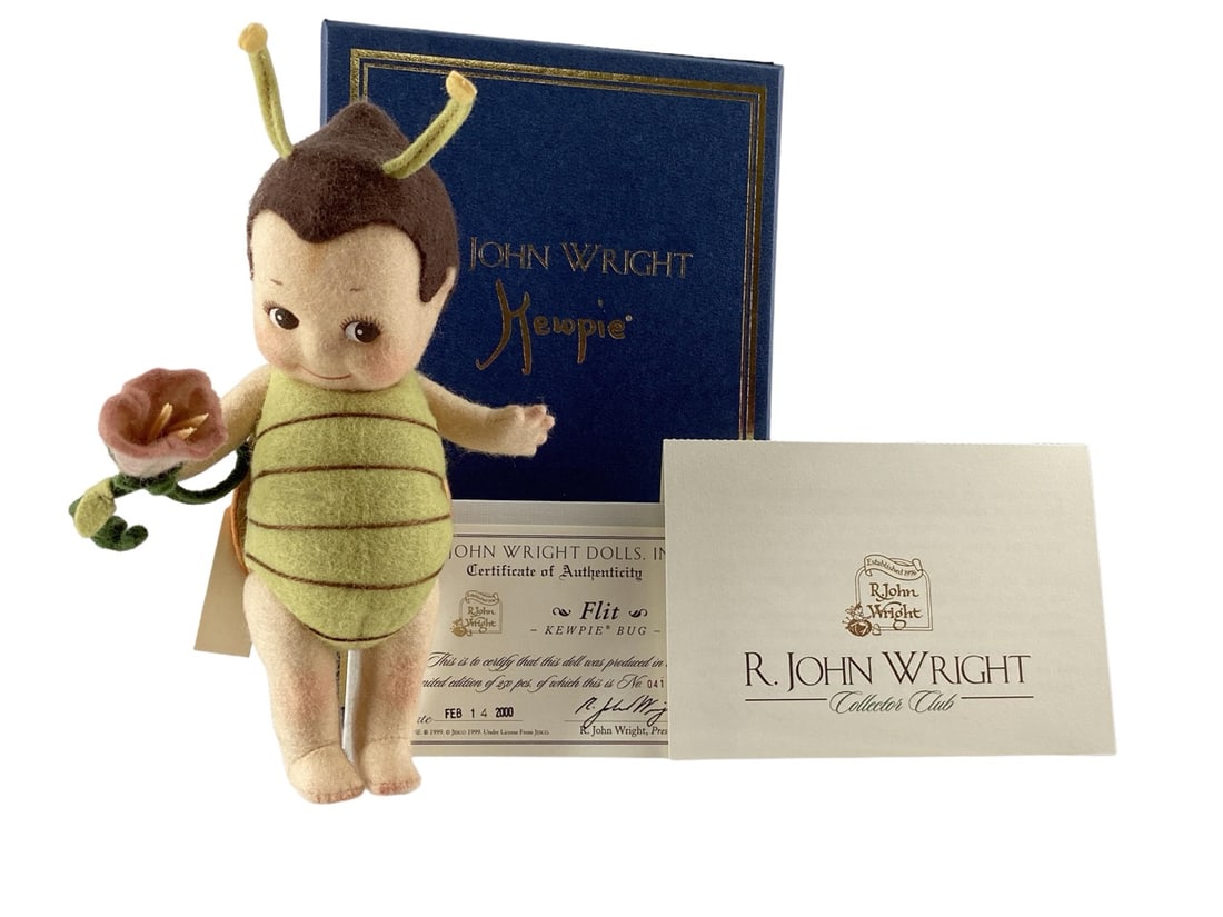 "Flit" Flower Kewpie by R. John Wright #041/250: "Flit" Flower Kewpie by R. John Wright #041/250Dated February 14, 2000. Flit was the first of the KewpieÆ bugs. He featured a padded chest panel delineated with embroidery thread and separate back pa