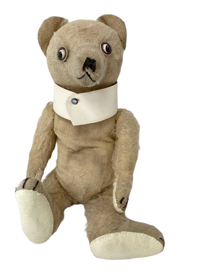 Well loved Googly Bear.: Well loved Googly Bear. 13 1/2" teddy with applied ears, tin disc googly eyes, long snout with stitched nose and mouth, disk jointed head, arms and legs. Paw pads have been replaced. Bear is so w