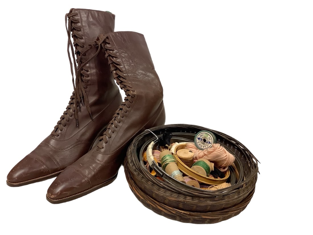 Vintage Boots and Sewing Accessories: Vintage Boots and Sewing Accessories Vintage lace-up leather boots and sewing accessories in round basket.