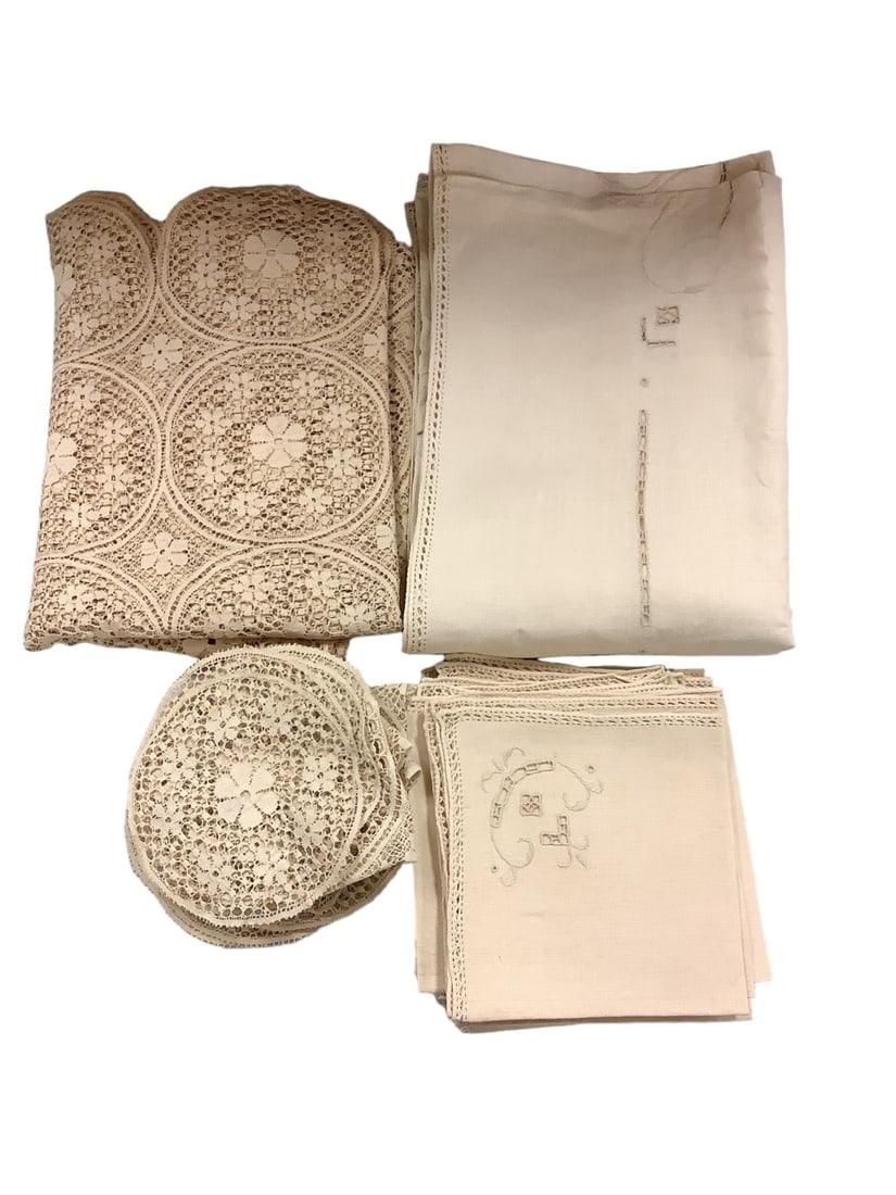 Linens: Linens1 tan tablecloth 5'x 7', 3 tan doily's 7" diameter, 6 tan placemats 14"x 14", 1 beige tablecloth 66"x 7', 12 beige napkins 16"x 16"