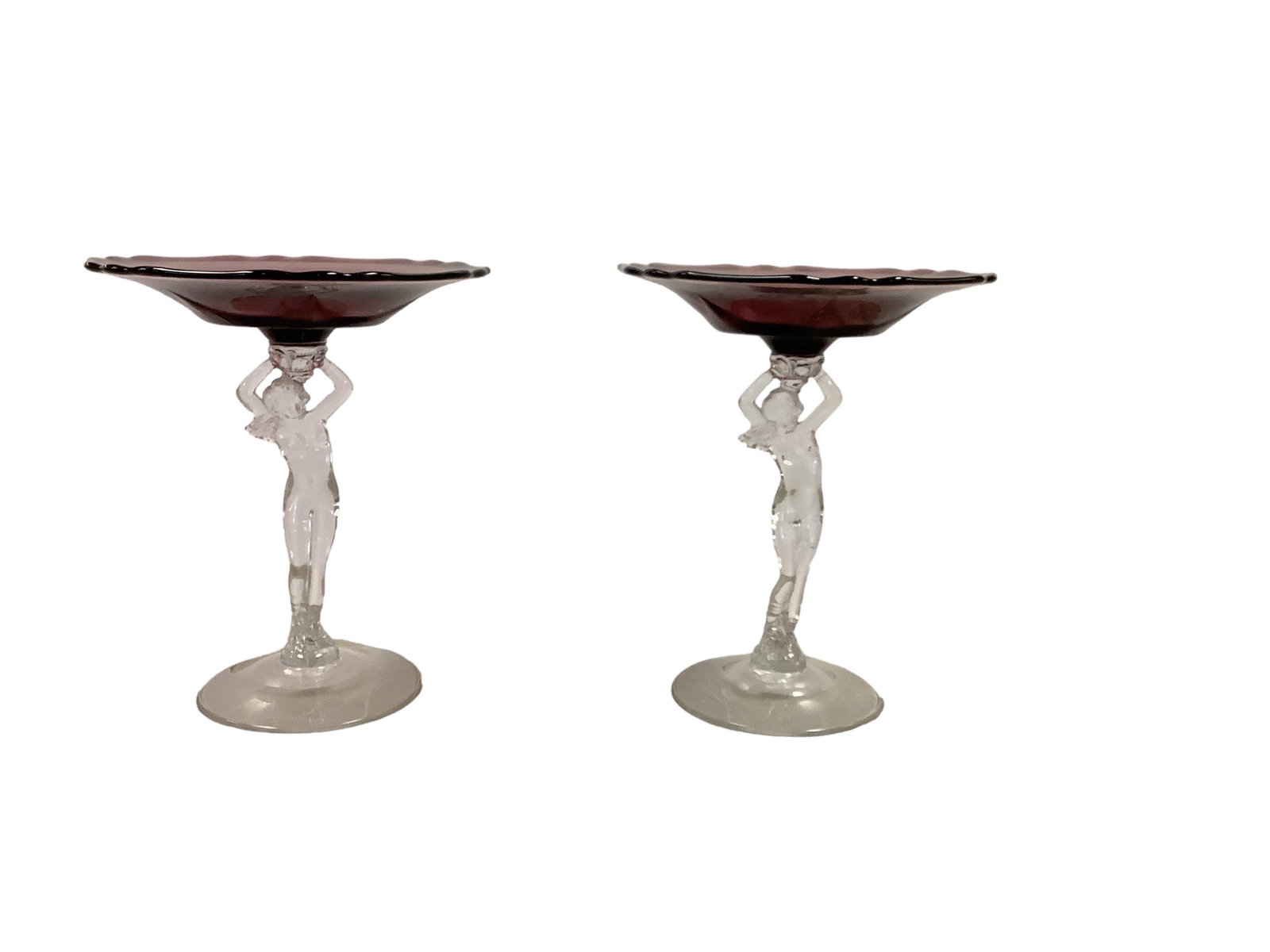 Pair of Cambridge Nude Stem Glass Compote Stands: Pair of Cambridge Nude Stem Glass Compote Stands Amethyst bowls and clear statuettes measure 8" tall.