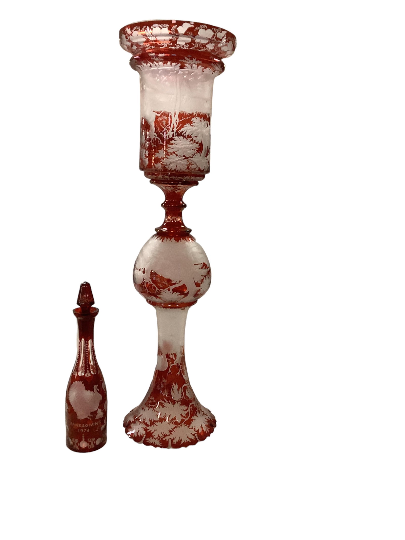 Bohemian Glass Hurricane Lamp and Wine Bottle: Bohemian Glass Hurricane Lamp and Wine Bottle Antique cut glass from ruby to clear. Lamp is two pieces and 45" tall. Bottle is 14.5" tall and engraved with "Thanksgiving 1973." **** NO IN HOUSE SHIPPI