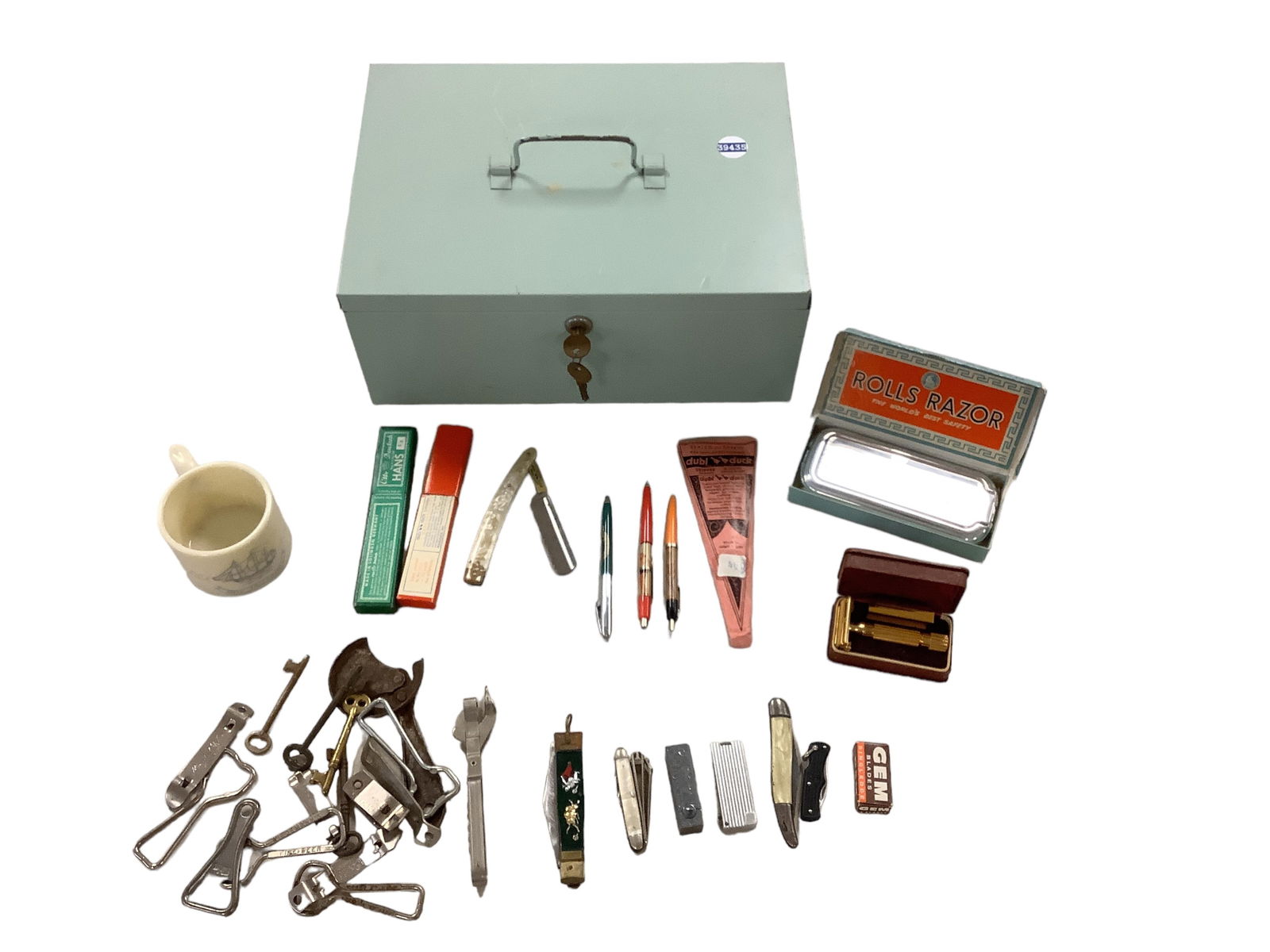 Metal lock box with razors, bottle openers and mug with "lady" pens (1 of 6)