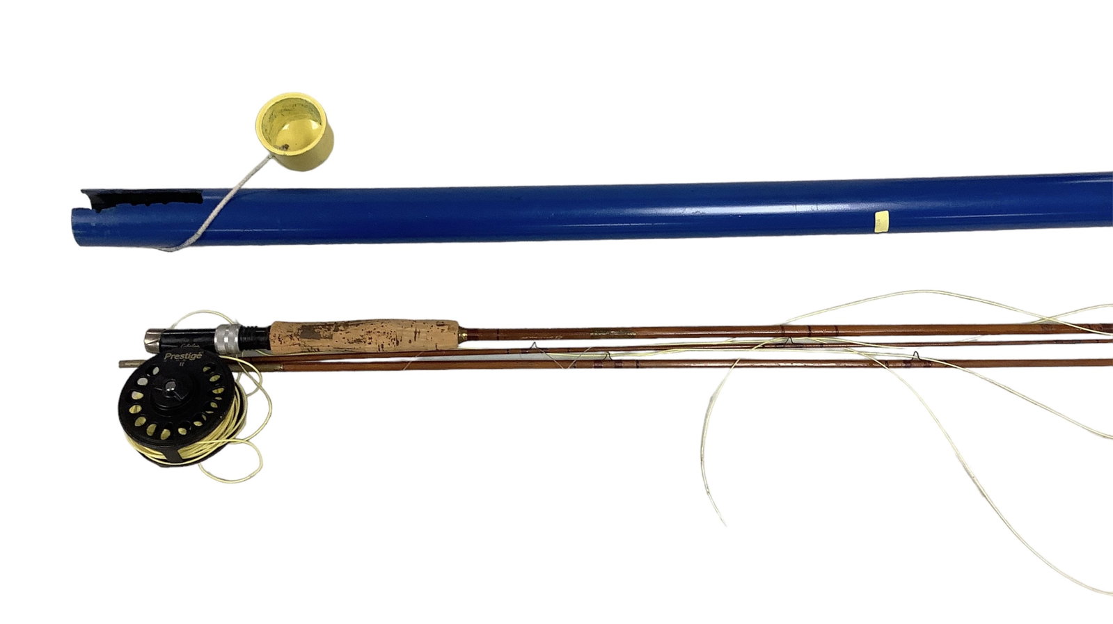 Cabela Prestige II Fly Reel with Vintage H&R Bamboo Rod: Cabela Prestige II Fly Reel with Vintage H&R Bamboo Rod One section of the rod is missing a part, see photo. Line and case is included.