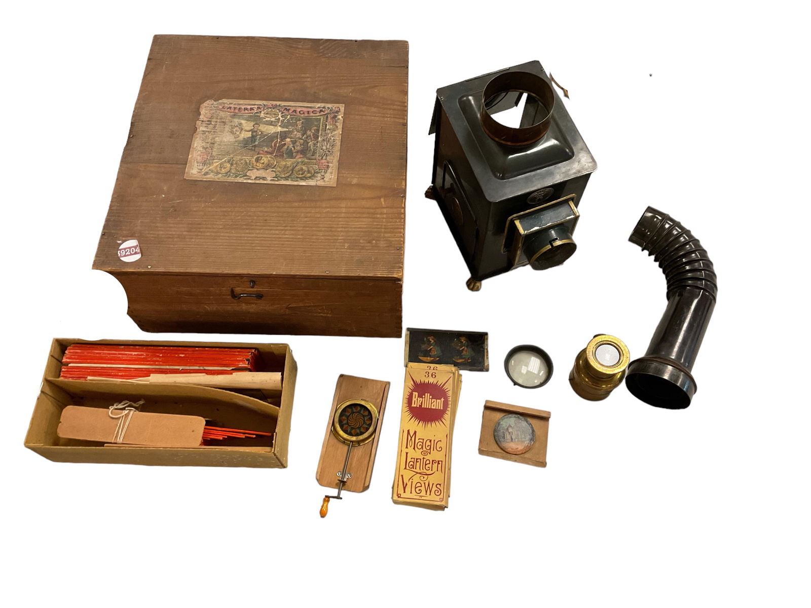 Antique Oil Lamp Magic Laterna Magica Gloria Glass Slides with Original Box: Antique Oil Lamp Magic Laterna Magica Gloria Glass Slides with Original BoxBrand E-P Oil burning slide projector, slides, lens ect. Missing foot on projector.