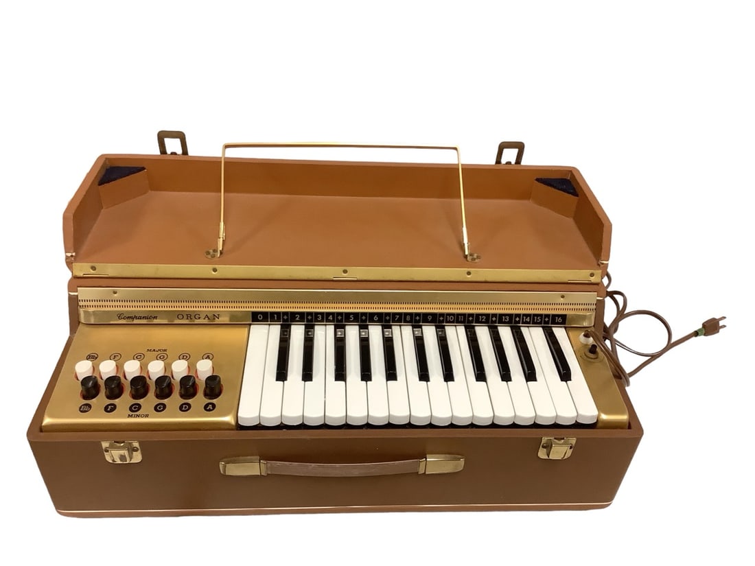 Companion Portable 28 Key Electric Organ: Companion Portable 28 Key Electric OrganBuilt in music holder. Case is 22" long x 10" deep x