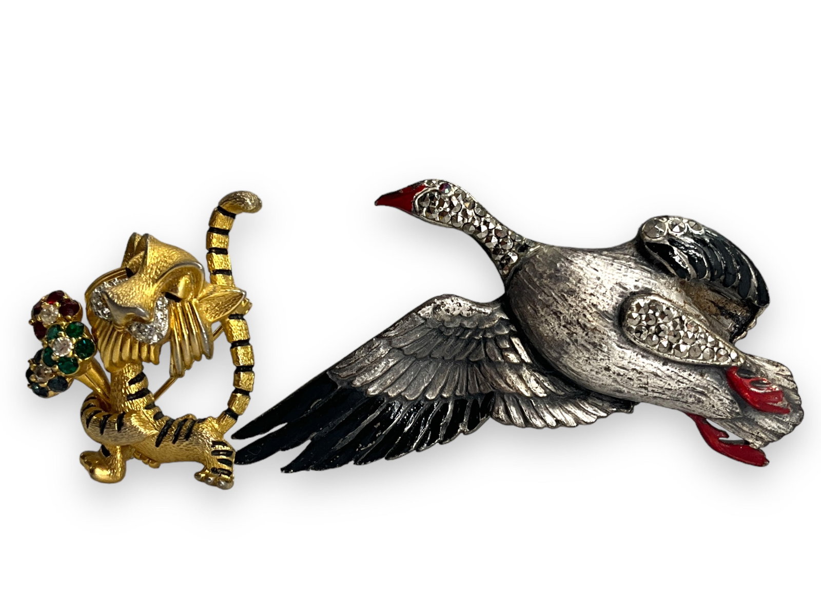 Lovely Duck Brooch and Cute Lion Pin: Lovely Duck Brooch and Cute Lion Pin Silver-tone metal duck brooch is striking @ approx 2 3/4" tall, having black enamel wings and red enamel feet and beak, pin has marcasite crystal decoration and a 