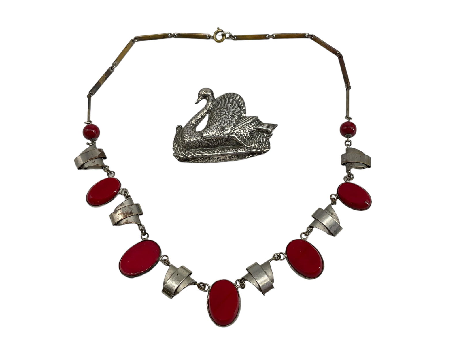 Silver Swan Brooch Hallmarked "Sterling Craft by Coro" and a Hallmarked "Czechoslovakia" Red Glass: Silver Swan Brooch Hallmarked "Sterling Craft by Coro" and a Hallmarked "Czechoslovakia" Red Glass NecklaceLot contains a brooch depicting a detailed swan and is signed on the reverse "Sterling Craft