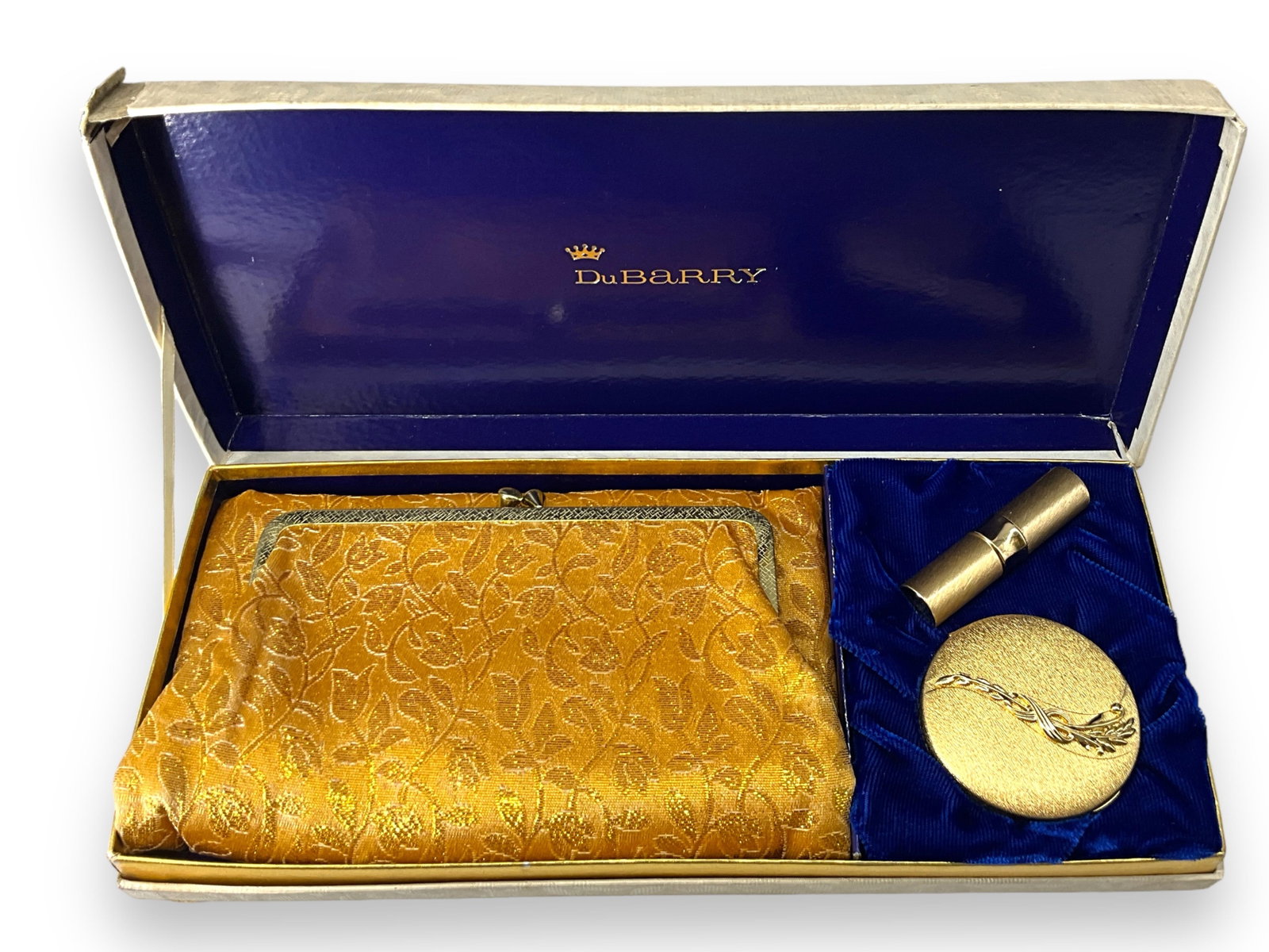 New Old Stock Vintage Ladies Evening Set From DuBarry: New Old Stock Vintage Ladies Evening Set From DuBarry Including a gold tone clutch, compact with powder - new!, and a new gold tone lipstick in "cool coral".