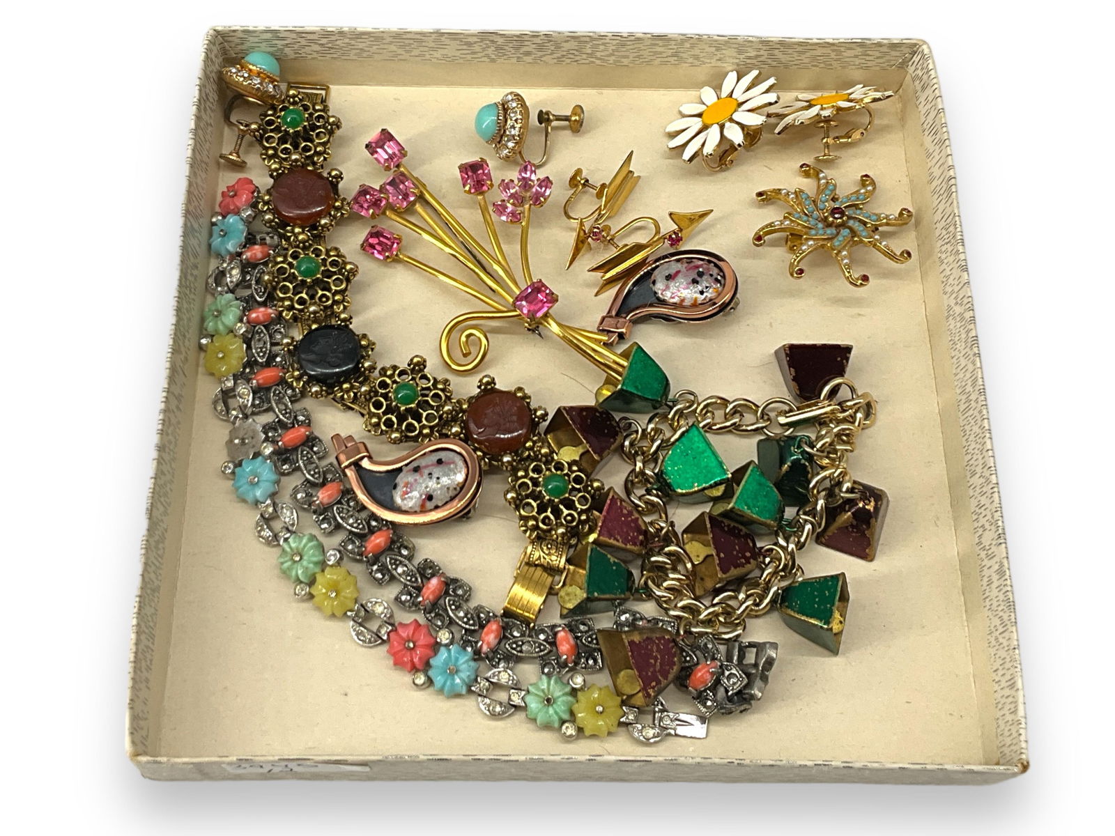 Lovely Assortment Of Vintage Jewelry: Lovely Assortment Of Vintage JewelryPair of gold tone screw-back earrings with arrow motif and pink rhinestone accent, pair of screw-back earrings with daisy motif, gold tone open stamped sterling wit