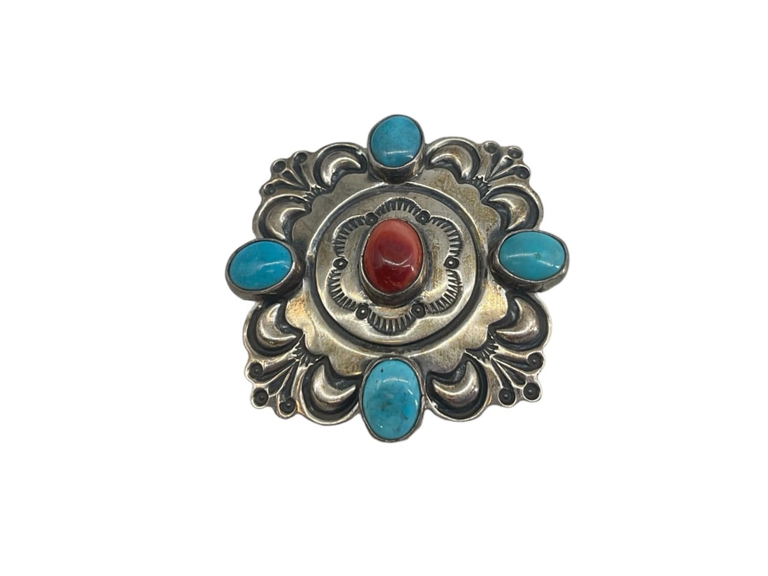 Signed Sterling Silver Southwestern Pin: Signed Sterling Silver Southwestern Pin Measuring (approx. 1.52" x 1.52") with turquoise and coral cabochons, signed "A. Caiman" on the reverse (0.42 troy oz tw). *** CORAL CAN ONLY BE SOLD TO BUYERS 