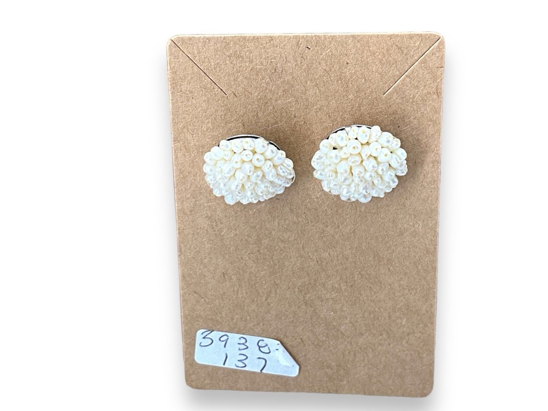 Vintage Pearl Cluster Earrings: Vintage Pearl Cluster EarringsPost back earrings with a cluster of rice pearls radiating from the center approx. (0.78") in diameter, unknown maker.