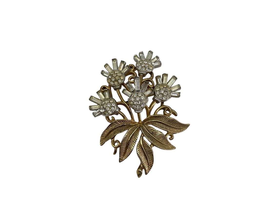 Older Trifari Thistle Brooch: Older Trifari Thistle Brooch Dual tone design (2.55" x 2") with clear fashion crystals and polsihed gold tone elements, signed Trifari with a capital "T" on the reverse.
