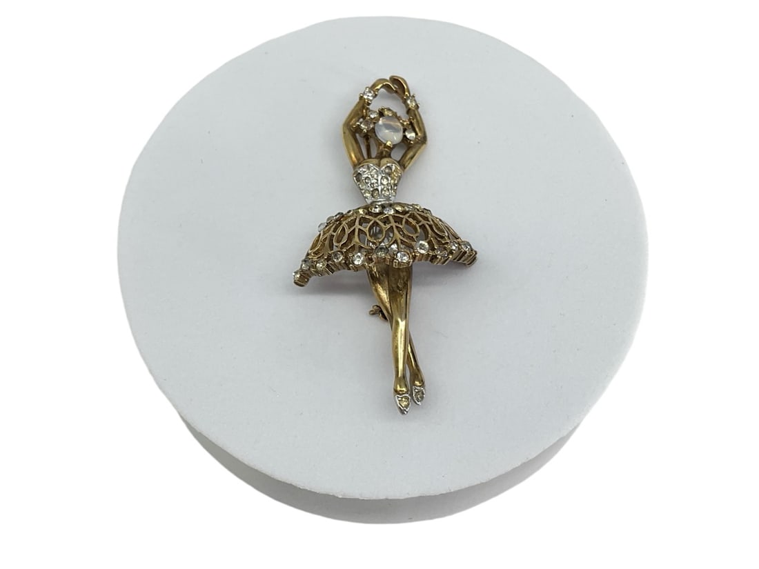 1940's Crown Trifari Ballerina Pin: 1940's Crown Trifari Ballerina Pin Dual tone gold washed design measuring (2.72" x 1.34") with clear fashion crystals and a moonstone fashion crystal cabochon face, one stone missing from shoes, skirt