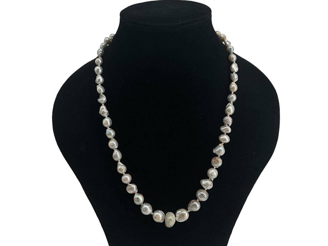Vintage Graduated Pearl Necklace: Vintage Graduated Pearl Necklace Measuring (19") in length with pearls ranging in size from (6.2mm - 12.1mm) moderate - strong luster, moderate blemishes, finishing with a sterling silver fishhook cla