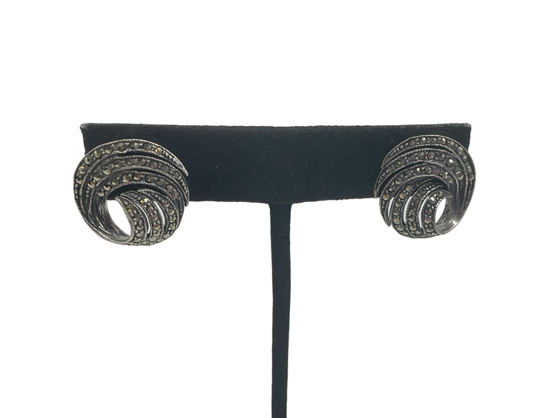 Pair of Sterling Silver Earrings with Marcasite Stones: Pair of Sterling Silver Earrings with Marcasite Stones Pierced style on posts, 18.5mm in size, spiral design, 0.195 troy ounces total weight, set with small faceted marcasite accent stones.