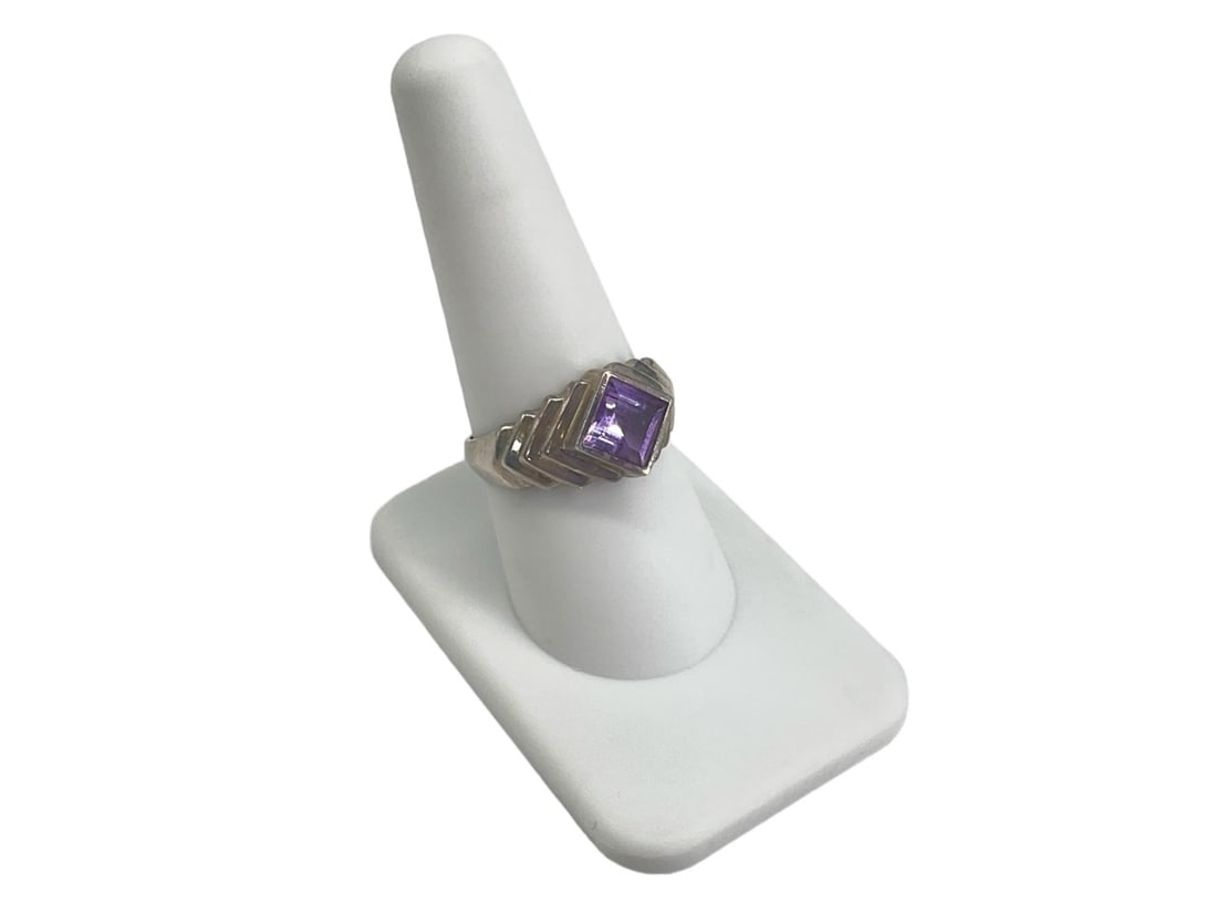 Sterling Silver and Amethyst Semi-Precious Stone Ring: Sterling Silver and Amethyst Semi-Precious Stone Ring Stamped sterling silver/925, set with 9.75mm princess cut amethyst semi-precious stone at center, tapered shank with ridges and a semi-polished me
